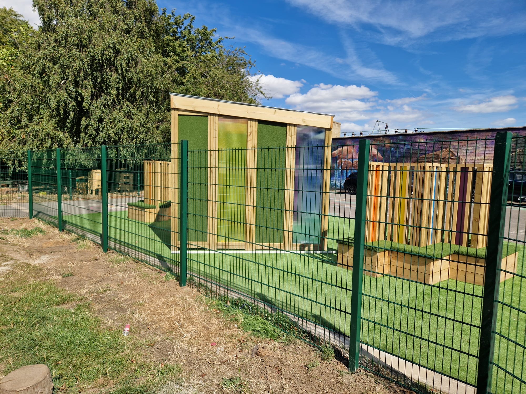 Completed mesh fencing enclosing the school's outdoor play area