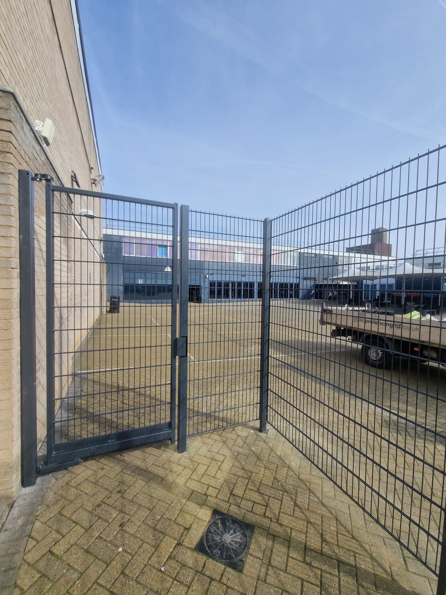 Mesh double gates to a school playground