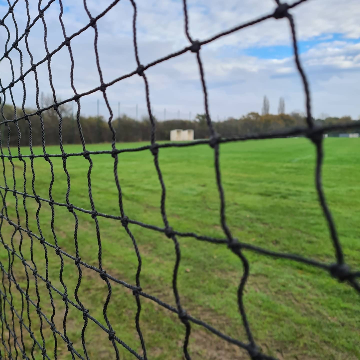 Ball stop netting overlooking a sports pitch